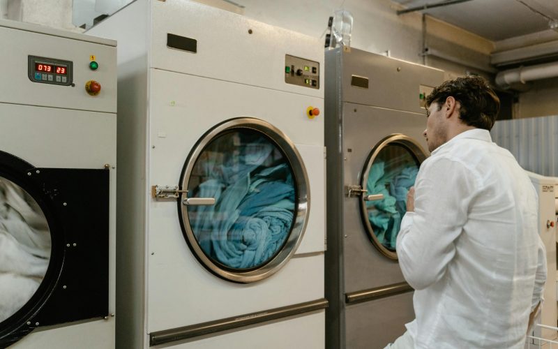 Dryer repair service in Fontana California technician checking commercial laundry dryer machine